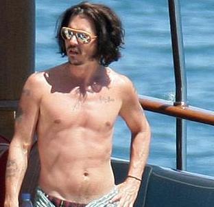 Johnny Depp Tries A Slice Of Island Life